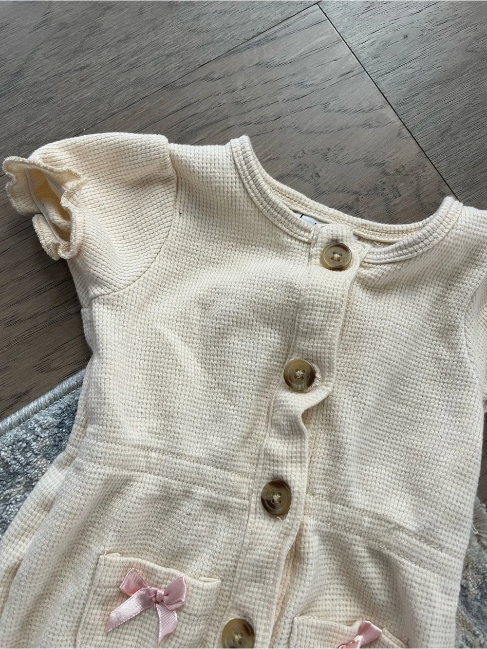 Cream Baby One-Piece Bodysuit with Pink Bow Pockets